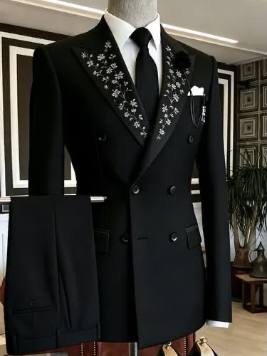 Embroidered Black Wedding Suit. A formal black wedding suit with detailed lapel embroidery.